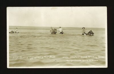 Cowboys cooling off after a hot ride Four cowboys on their horses- Old Photo
