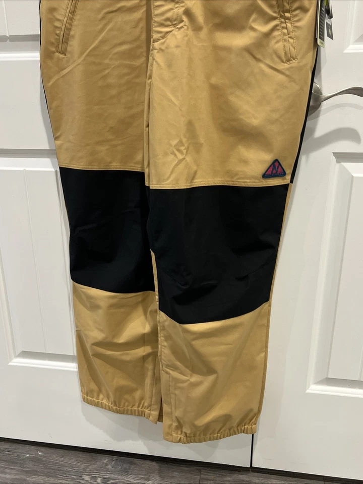 Pantalones de nieve Neff Roan con tirantes para hombre talla XL caqui/negro con bolsillos tostados. Foto 4 de 4