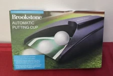 NIP / SEALED Brookstone Automatic Putting Cup Cordless Portable