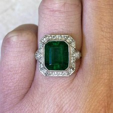 4CT Emerald Cut Green Emerald Halo Style Engagement Ring in 925 Sterling Silver.