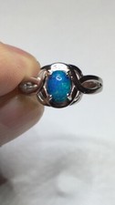 113B- .55ct Genuine Ethiopian Welo Opal set in a Size 8 Sterling Silver Ring