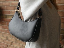 Black Crescent Shoulder Bag - modern sleek design interior pocket - gold accents