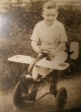 Snapshot of Boy in Pedal Car Airplane