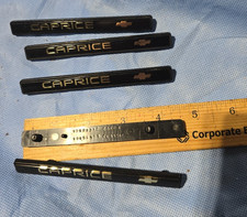Chevy Oem 1992-1996 Caprice Black Interior Dash Board Emblem 10104389 10104390