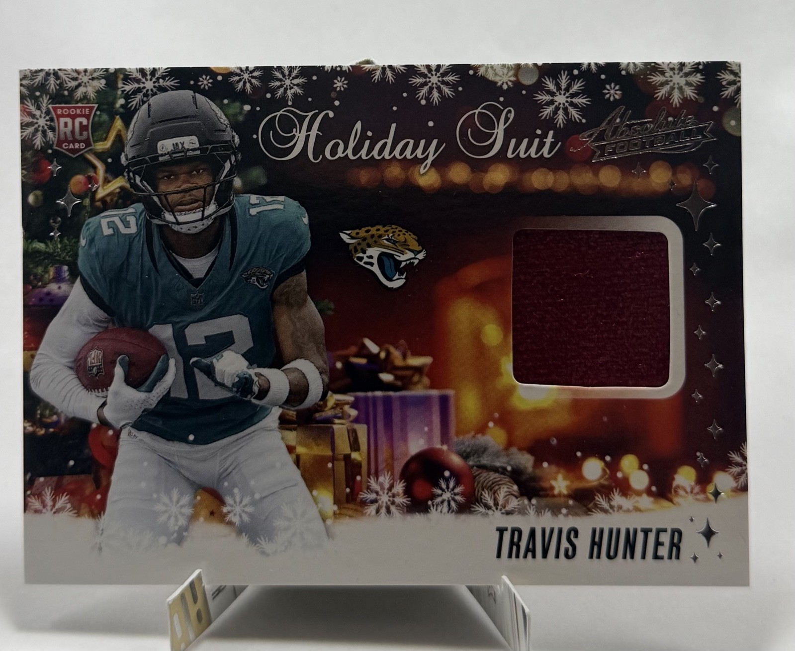 2025 Panini Absolute - Holiday Suit Travis Hunter #HS-THR (RC)