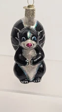 Animals By Old World Christmas- Li'l Stinker Skunk Ornament