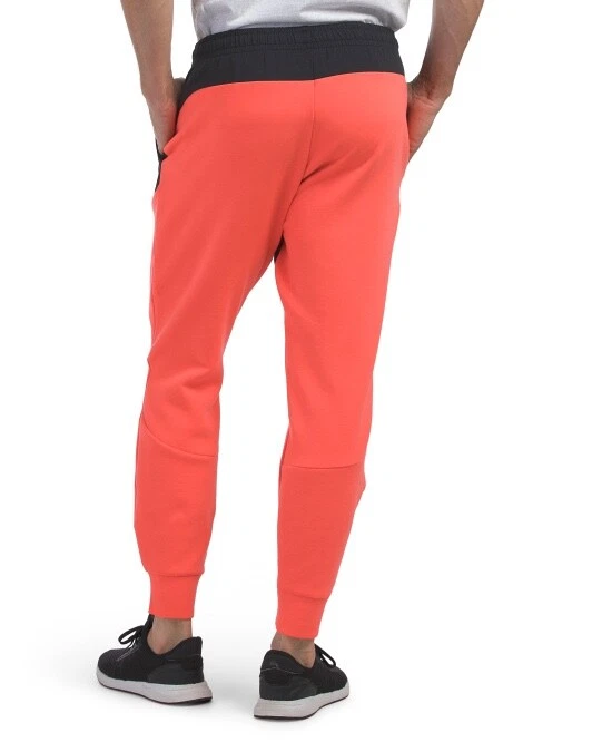 XL NUEVO CON ETIQUETAS Para hombres Under Armour Coral/Negro Imparable Polar Joggers Foto 2 de 2