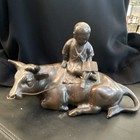 Cow Figurine Statue with Boy Riding on Top, Lying Cow/Bull Animal Figure — photo 1