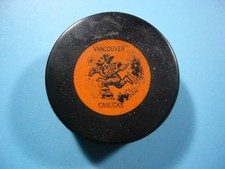 1960'S CONVERSE VANCOUVER CANUCKS OFFICIAL MADE IN CANADA WHL HOCKEY PUCK ORANGE