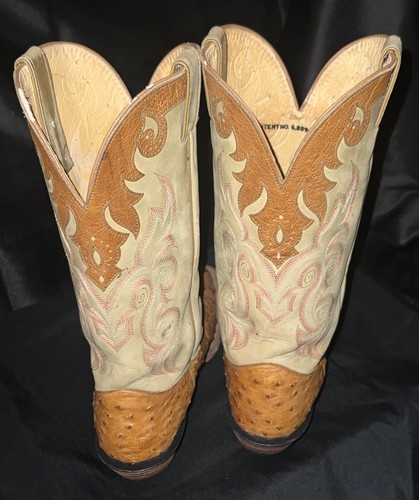 Tan ostrich leather women's full quill boots with pointed toes and ornate Western flame and swirl patterns on heels.