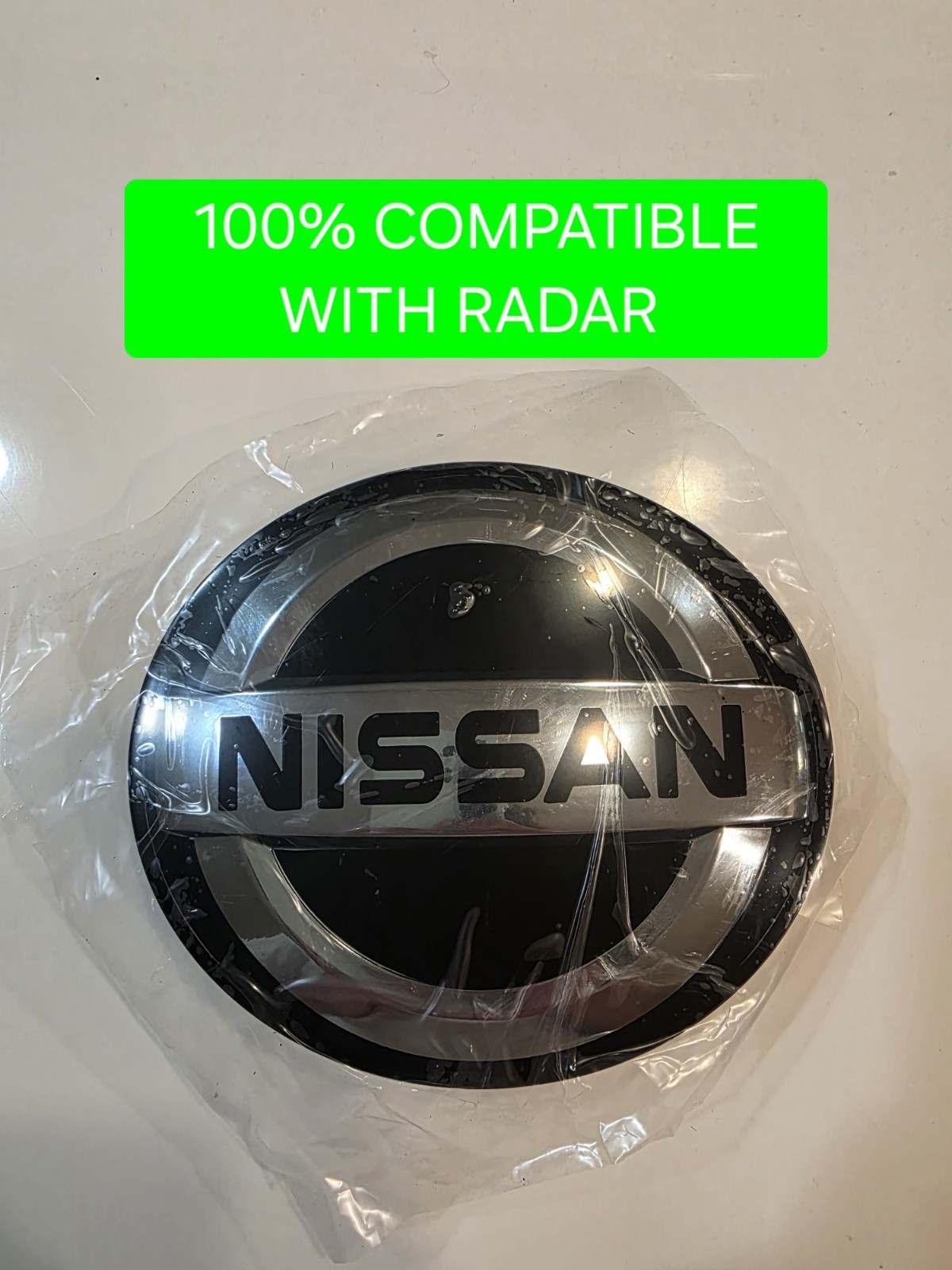 NISSAN VERSA / SENTRA 2020-2021-2022 FRONT GRILLE EMBLEM 62890-6LH0A RADAR COMP