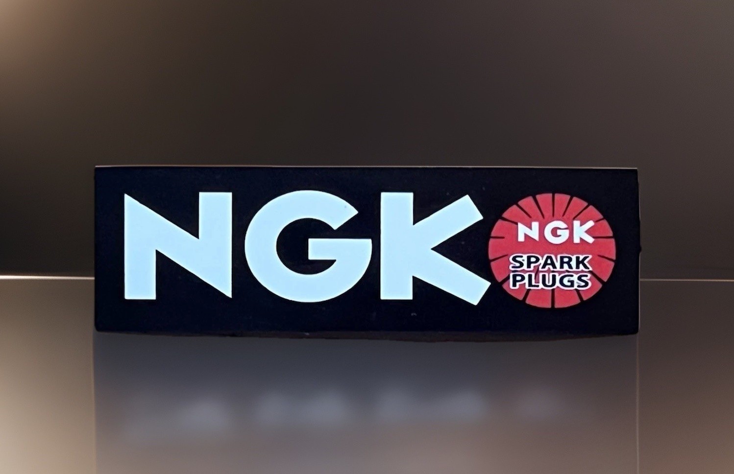 NGK spark plugs GlossyFinish. Approx Size: 3.75X 1inch. Self Adhesive