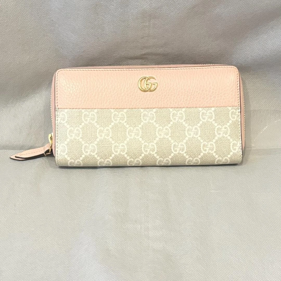 Portefeuille Gucci rose beige en cuir motif GG fermeture éclair longue   Excellent état de JP