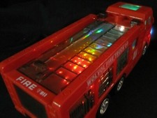 Wolvol Electric Fire Truck Toy Stunning 3D Lights and Sounds Goes Around
