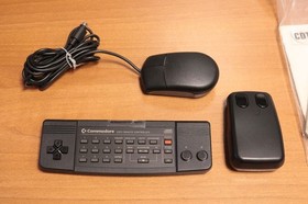 CCOMMODORE CDTV BOXED + CD-1221 KEYBOARD + CD-1253 MOUSE + GENLOCK 1301 LV4 91184