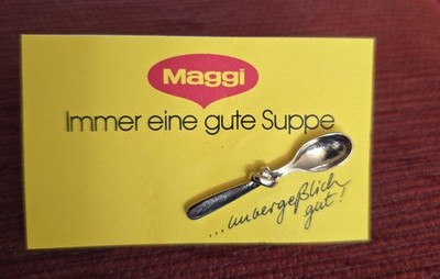 MAGGI-Das Kultgewürz in Deutschland-kleiner Knotenlöffel-auf Folder-versilbert-