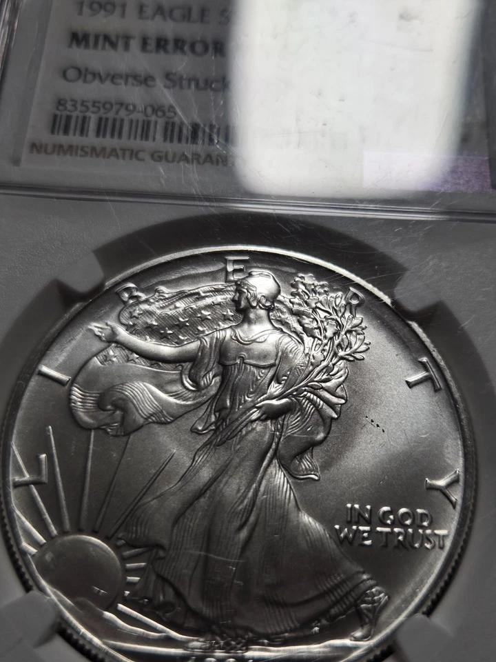 1991 Silver Eagle NGC MS69 MINT ERROR Obverse Struck Thru (Z-1132) - Image 2 of 3