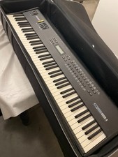 Alesis QS8 Professional 88-Key Weighted Synthesizer in great condition with case