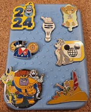 Disney 7-pin trading pack with pin board. 