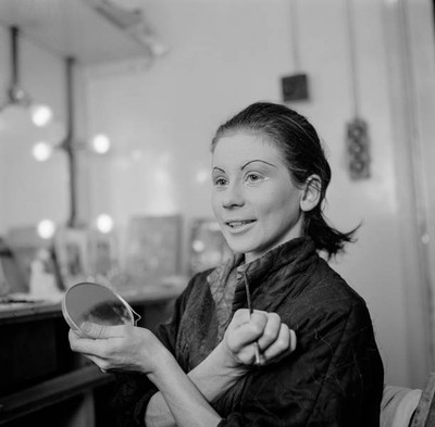 Ballerina Lucette Aldous holding a hand mirror brush after applyin- Old Photo