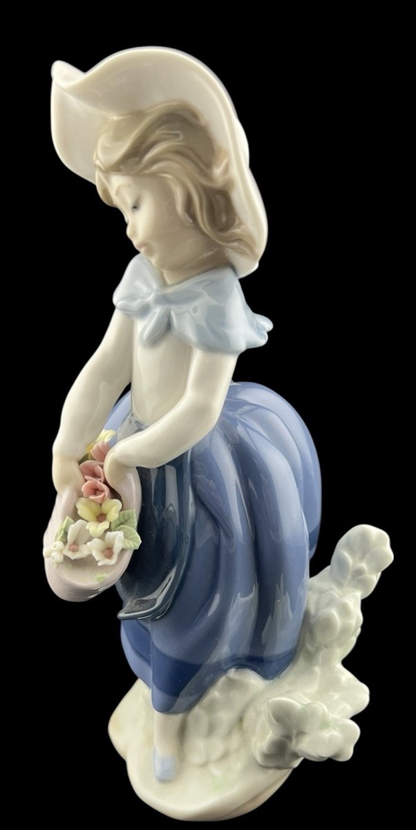 a Lladró porcelain figurine Vintage 1984 Lladro Porcelain Figurine Pretty Pickings Girl w
