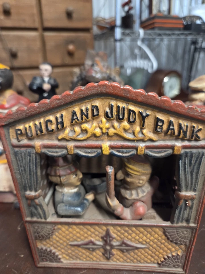 Banco mecánico original antiguo Punch and Judy de hierro fundido 1884 Foto 2 de 4