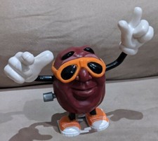 CALIFORINA RAISINS 1988 WIND-UP NASTA WORKS ORANGE GLASSES walking