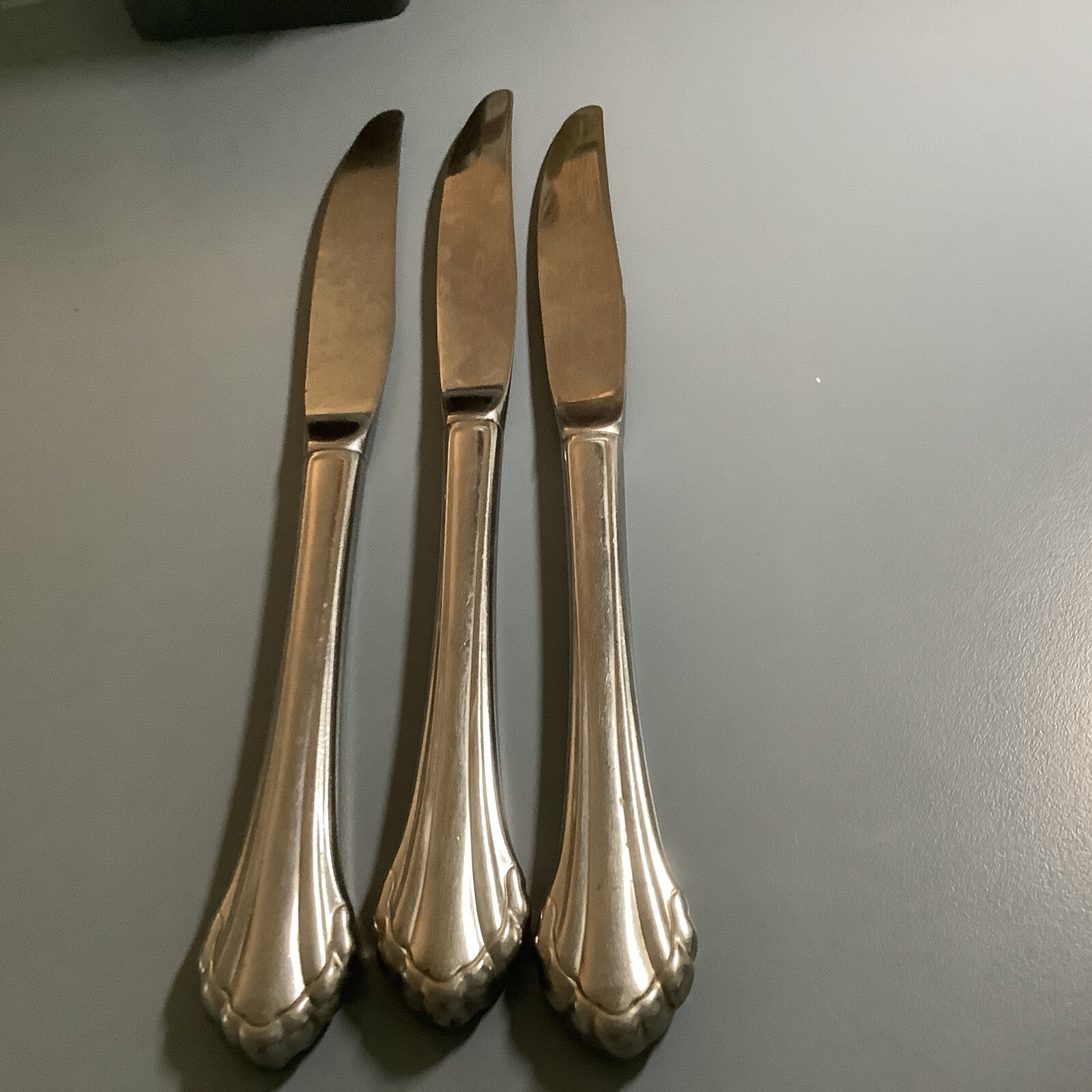 3 Oneida Clarette stainless Dinner knives