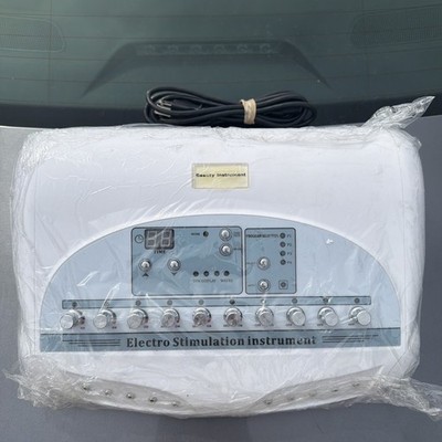 Electro Stimulation Instrument for Muscle Relaxation UNTESTED NO STICKY PADS
