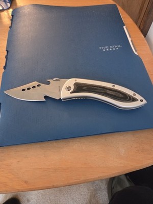 Pocketknife Unbranded,  pretty sharp with guthook. Very Nice Knife.