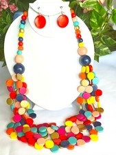 Clip on multi colored wood multi strand bead layered necklace and earring set