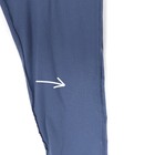 Close-up of a seam on a blue dress pant leg with white zigzag stitching and a small white arrow graphic.
