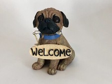 Resin Fawn Pug with Blue Collar and Welcome Sign Held by Gold Cords