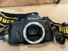 Nikon EM 35mm SLR Film Camera body only, Nikon strap  owners manual