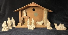 Nativity scene: 10 cream colored figures with manger