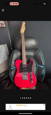 A Package Deal, Fender Mustang Lt25 Amp Alongside A Fender Squire Telecaster Red