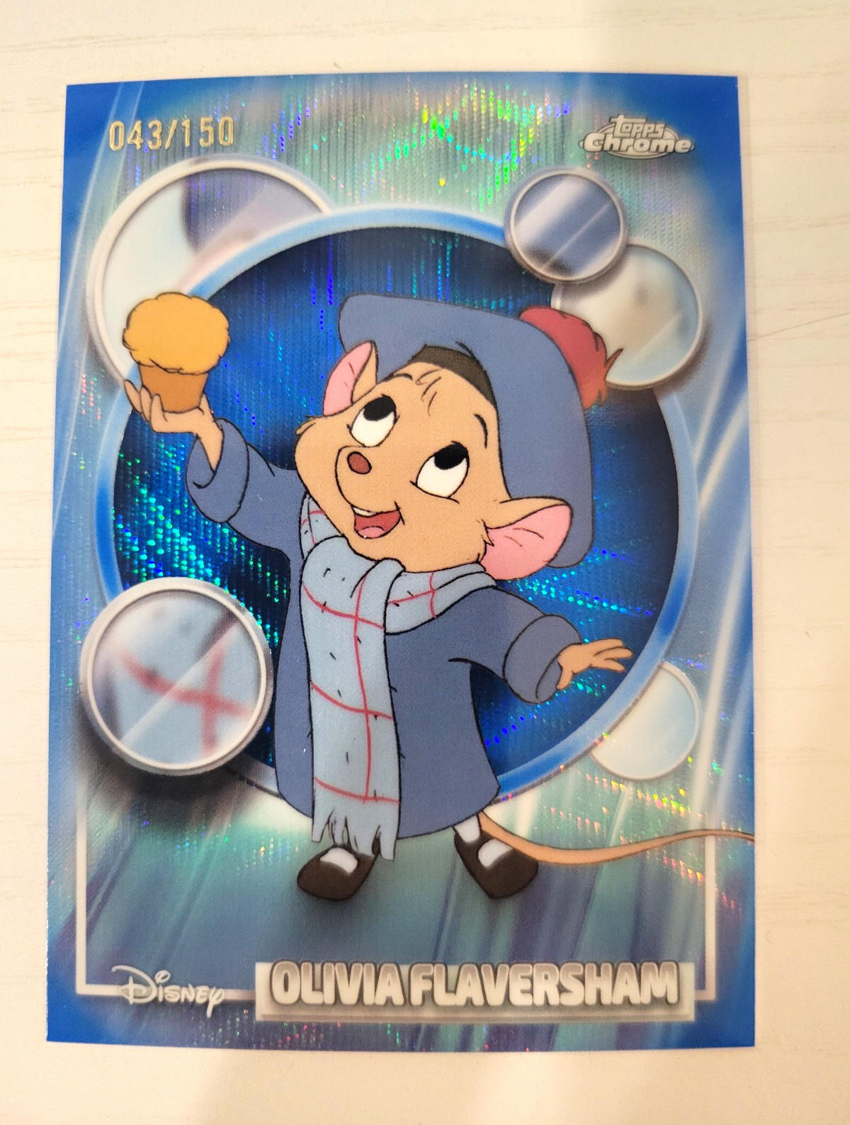 2026 Topps Chrome Disney Olivia Flaversham #42 Blue Wave Refractor /150