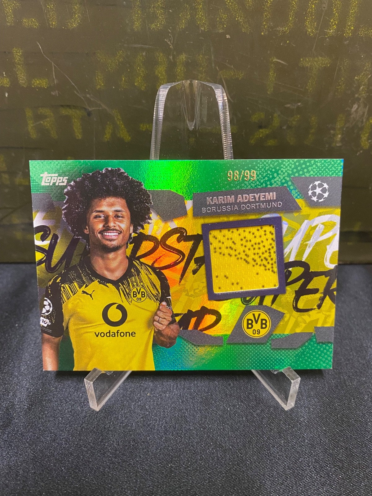Karim Adeyemi • 2025-26 Topps UEFA • Superstar Relics Green Foil • 82/99