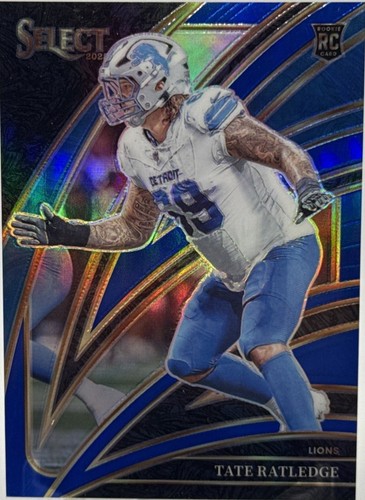 2025 Panini Select #270 Tate Ratledge Blue Prizm RC /99 Detroit Lions