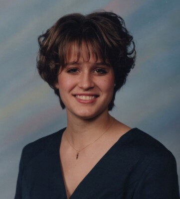 1990s Pretty Woman Short Brown Hair Smiling Studio Portrait Blue Backdrop