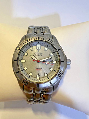 Citizen Watch Men Eco-Drive Titanium WR100 Day Date Silver Dial