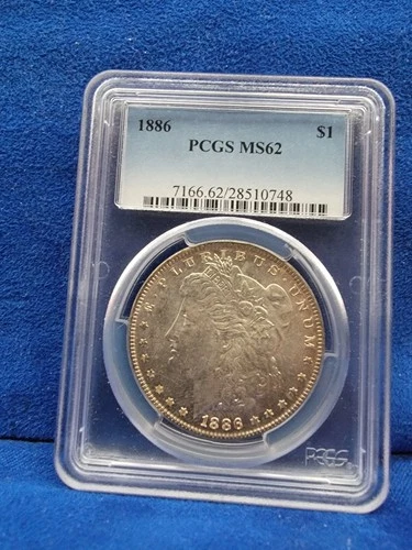 1886 Morgan Silver Dollar MS62 PCGS Certified light toned