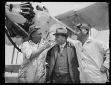 Captain Les Holden with Sam Tyler and Sam Harris in front of a pla- Old Photo