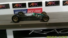 AFX RACING H.O. SCALE MEGA G+ 1.7 NARROW CHASSIS GOLD IN-LINE RIMS GREEN CAM