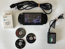 Sony PSP-3001 Black Console With Dvd’s Movies Charger And New Battery Bundle