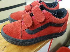 red and black strap vans