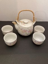 Vintage Japanese Ceramic Tea Set Featuring A Teapot And Four Cups