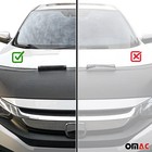 Black car bonnet mask hood bra with white logo sticker and red cross graphic on VW Touareg 2004-2010 front grille.