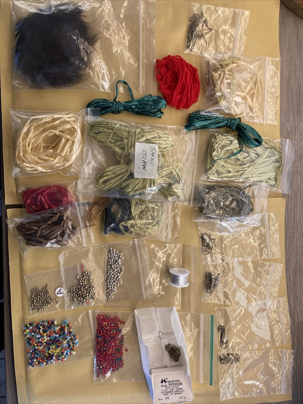 Fly Tying Job Lot. 300 brass beads, Raffia, hooks & bloodworm beads eBay