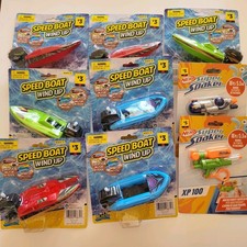 7 Speed Boat Wind Up and 2 Nerf Super Soakers New, Never Opened